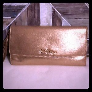 Lilly Pulitzer gold clutch with tassel